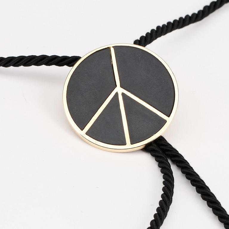MOSCHINO, a peace-sign necklace.