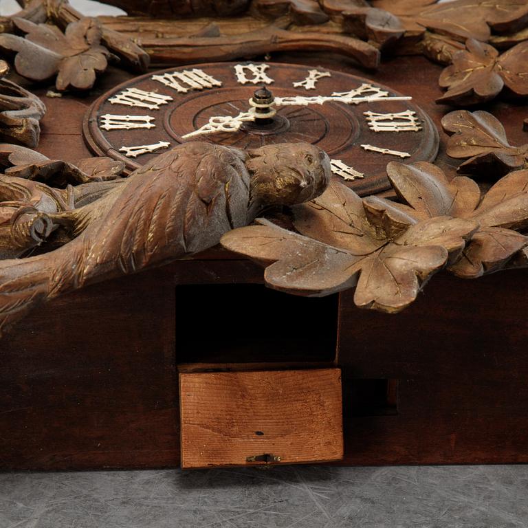 A Black Forest area pendulum wall clock.