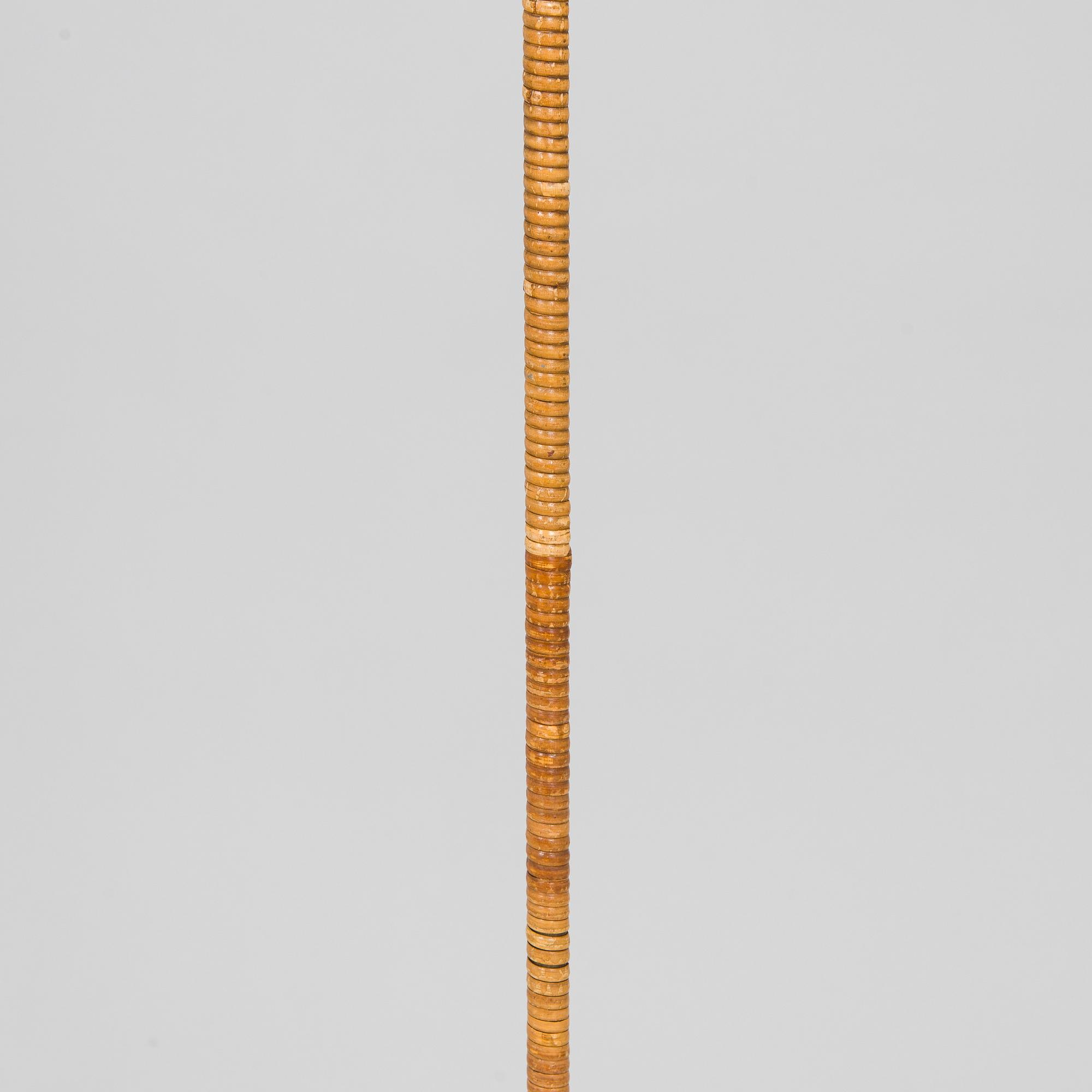 Paavo Tynell, a mid-20th century K10-10 floor lamp for Taito.