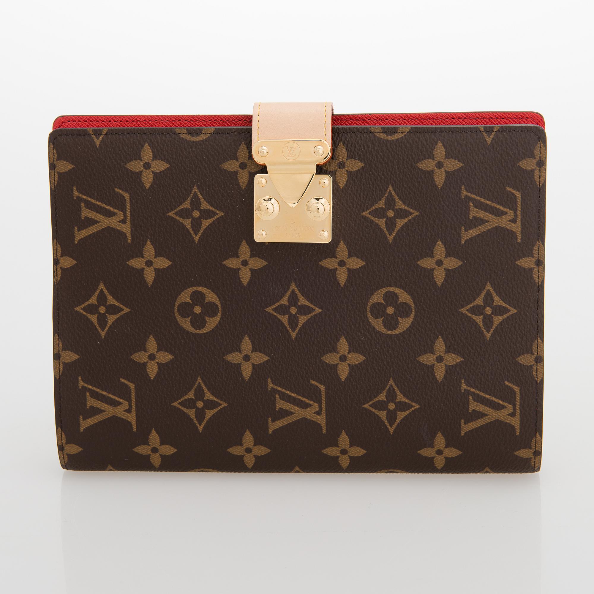 Louis Vuitton, A Monogram canvas Notebook cover 'Paul'.