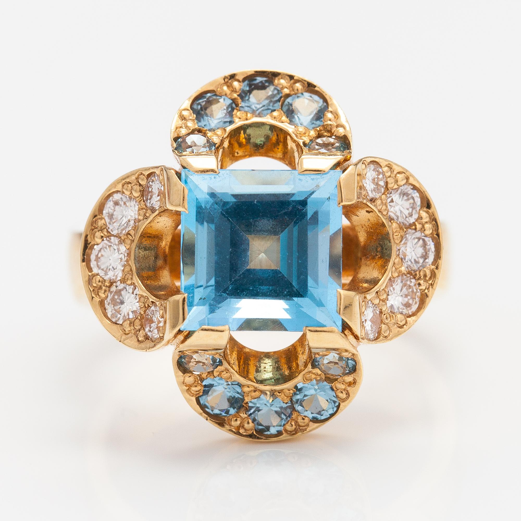 An 18K gold ring "Catherine Jagiellon" with diamonds ca 0.37 ct in total and topazes. Ofelia Jewelry, Helsinki 1998.