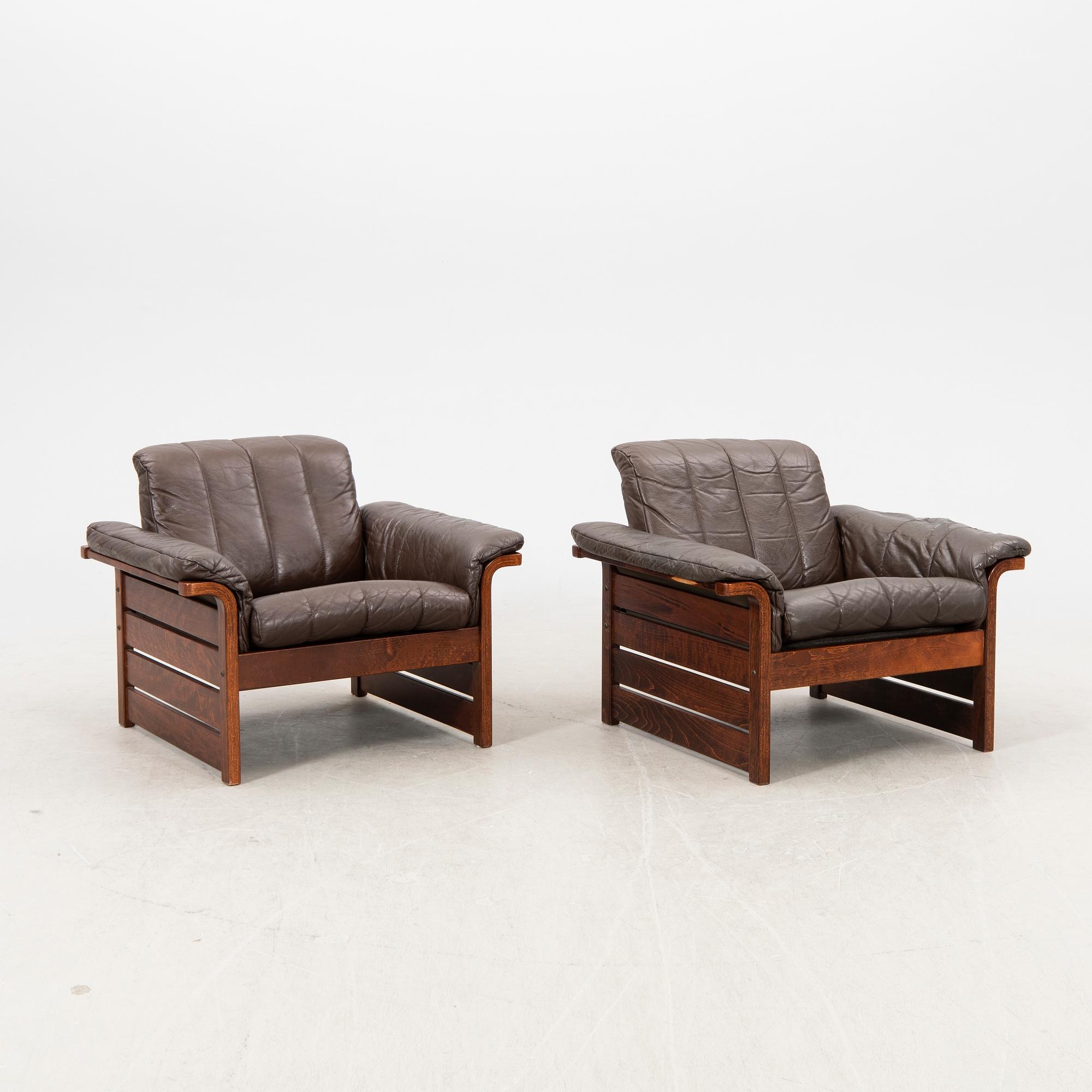 A pair of 1970s leather armchairs.