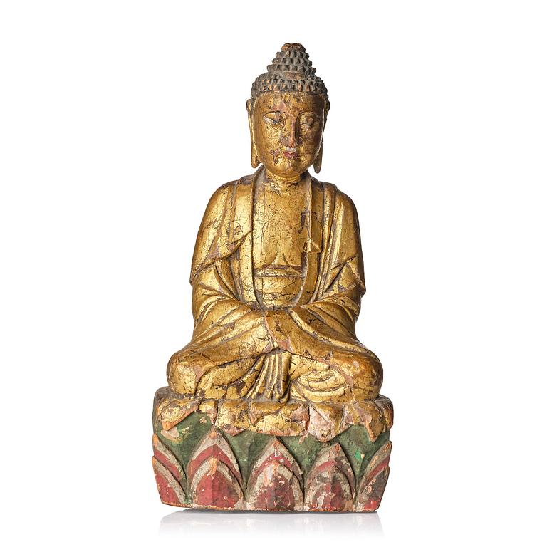 A wooden sculpture of Buddha, 19th century. With inscription to the back.