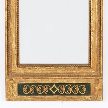 An Empire mirror, first half of the 19th Century.