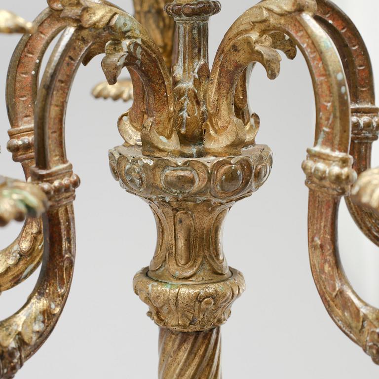 A pair of brass candelabras, 19th century.