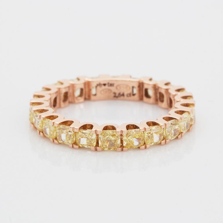 Cushion-cut yellow diamond eternity ring.