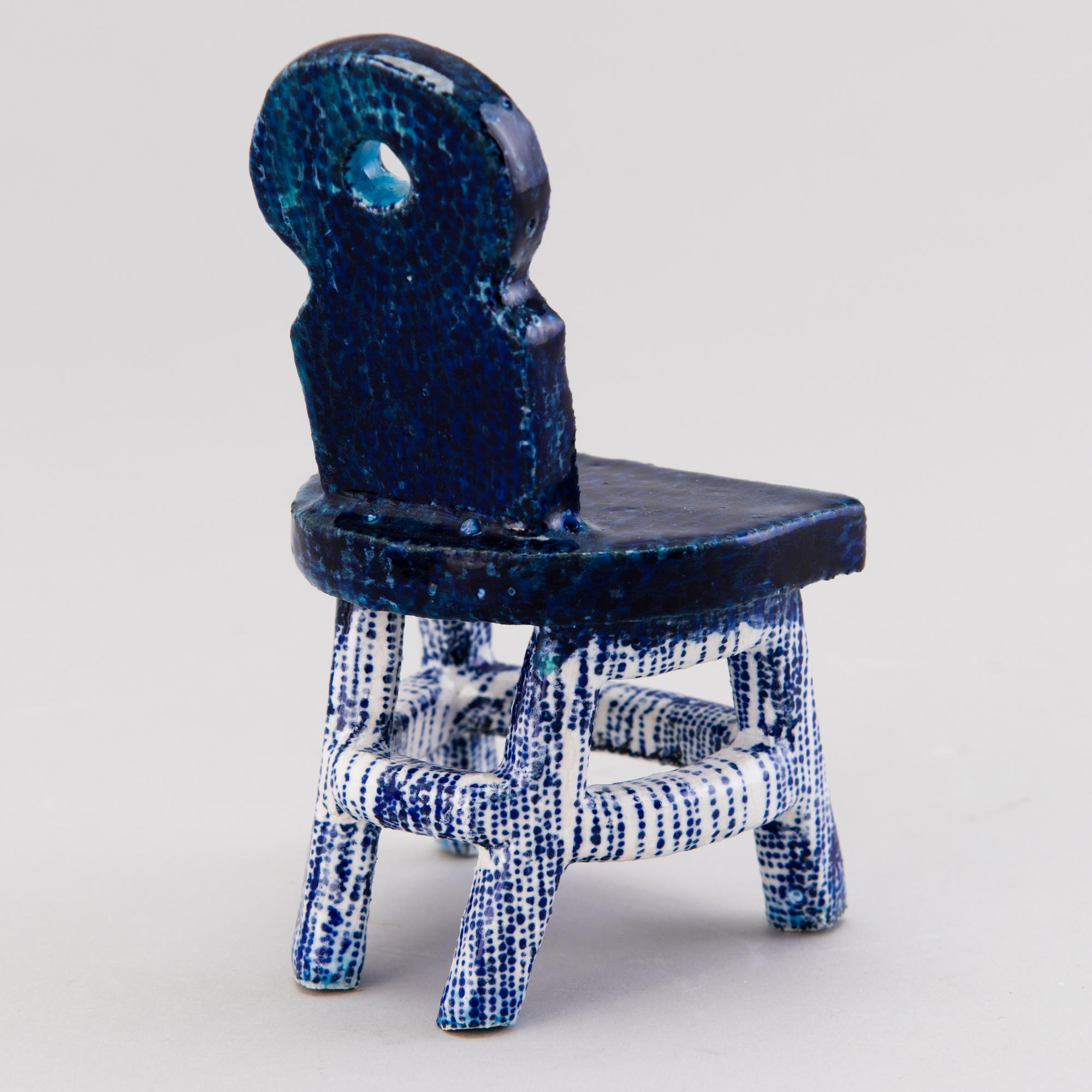 HEINI RIITAHUHTA, a porcelain miniature sculpture 'Chair' signed Heini Riitahuhta.