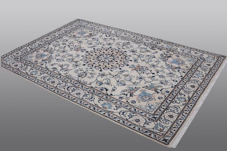 A rug, Nain, part silk, 238 x 163 cm.