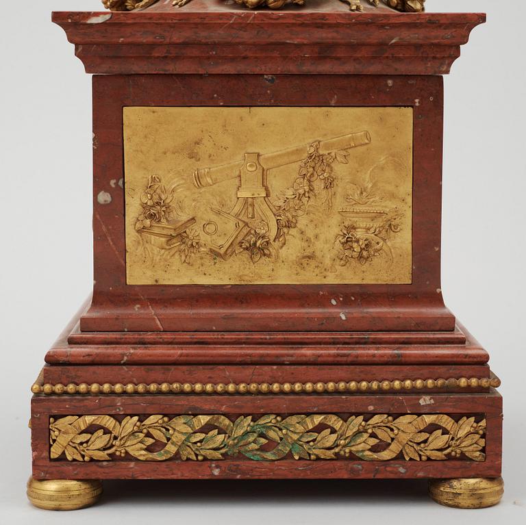 A Louis XVI-style late 19th century gilt bronze and marble vase clock "Pendule à cercles tournants", Dufaud Paris.