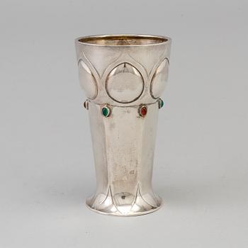 A Swedish Art Nouveau parcel-g beaker decorated with carneols and garnets, maker's mark Julia Anderson, Stockholm, 1909.