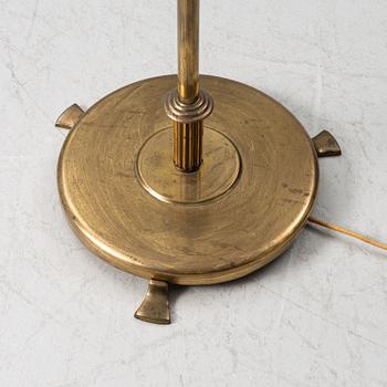A brass floor lamp, 1940s.
