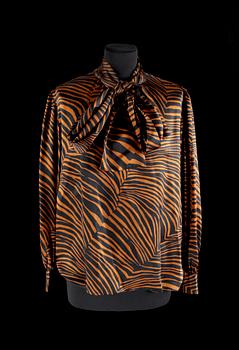 A set of two blouses by Yves Saint Laurent.