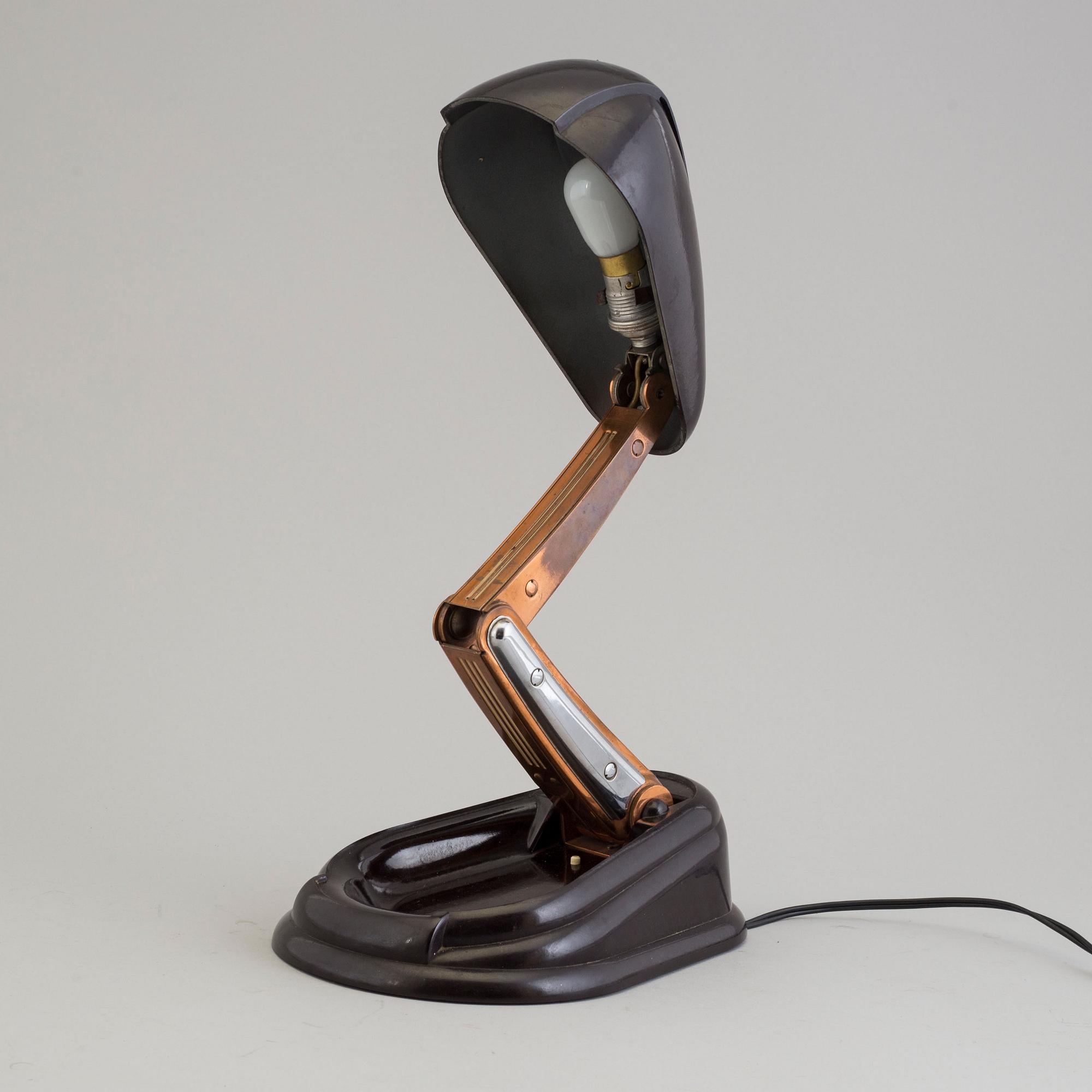 a bakelite and metal table 'Bolide' table lamp, by JUMO, 1940's.