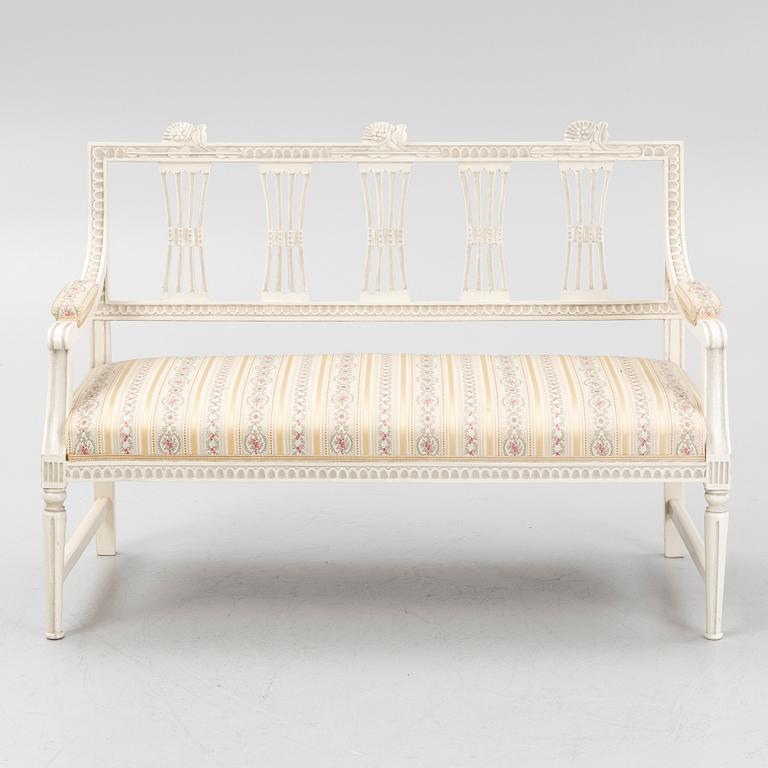 A sofa, three chairs and a table, Gustaivan style and of the Gustavian period, 19th-20th century.