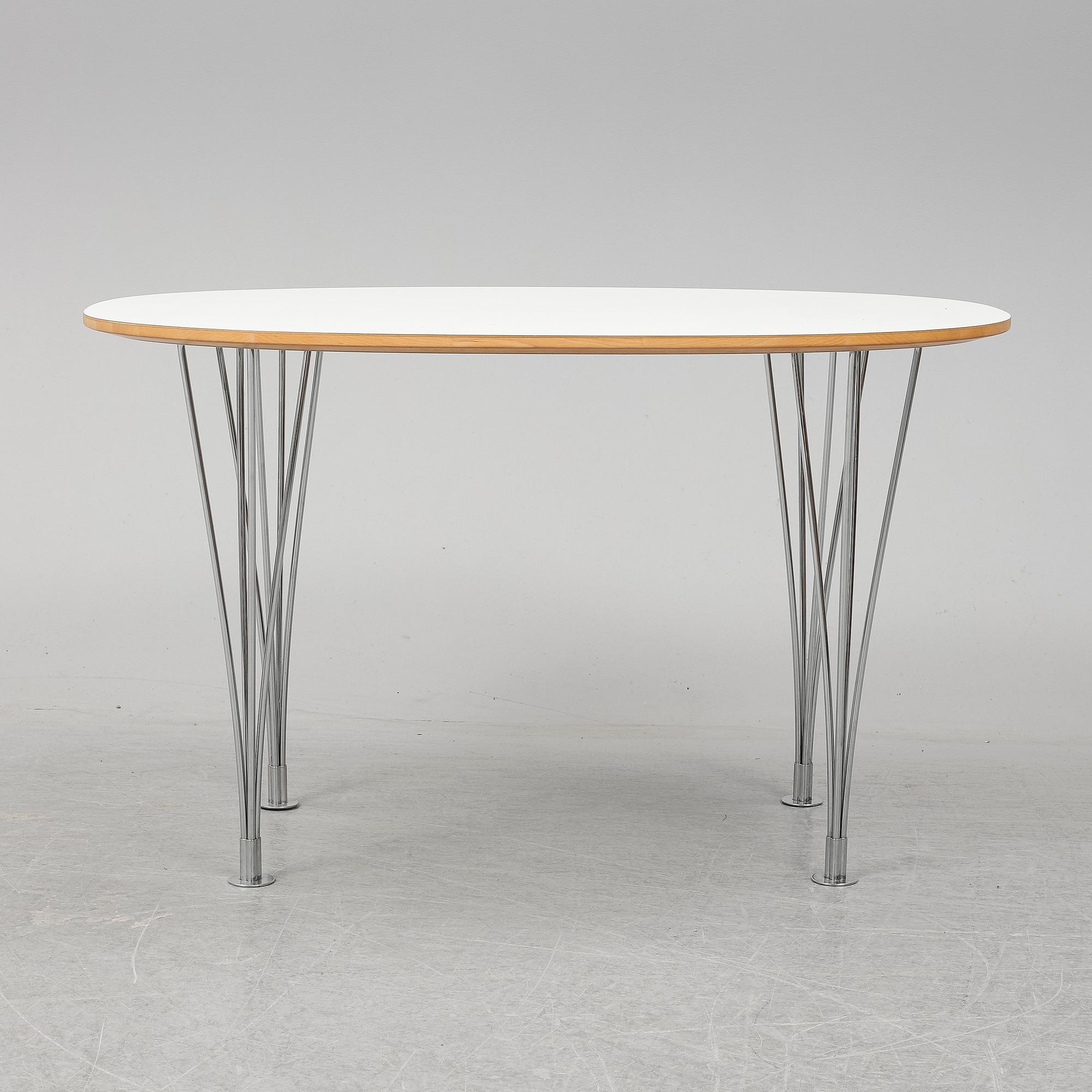 A 'Superellips" table by Bruno Mathsson & Piet Hein for Mathsson International darted 2011.