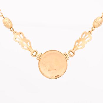 KAULAKORU, "Aurinkoleijona", 18K kultaa. Kalevala Koru 1998.