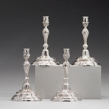 Two pairs of Swedish 19th and 20th century silver candlesticks, mark of Mollenborg and Jensen, Stockholm 1857 and 1936.