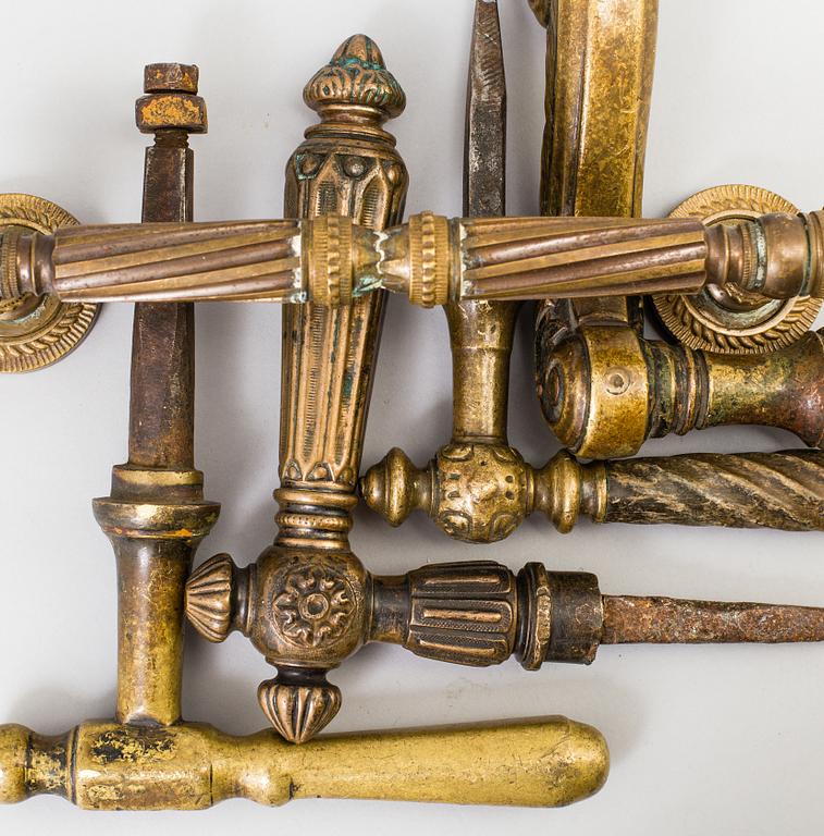 FIVE BRASS DOOR HANDLES, 19th century.