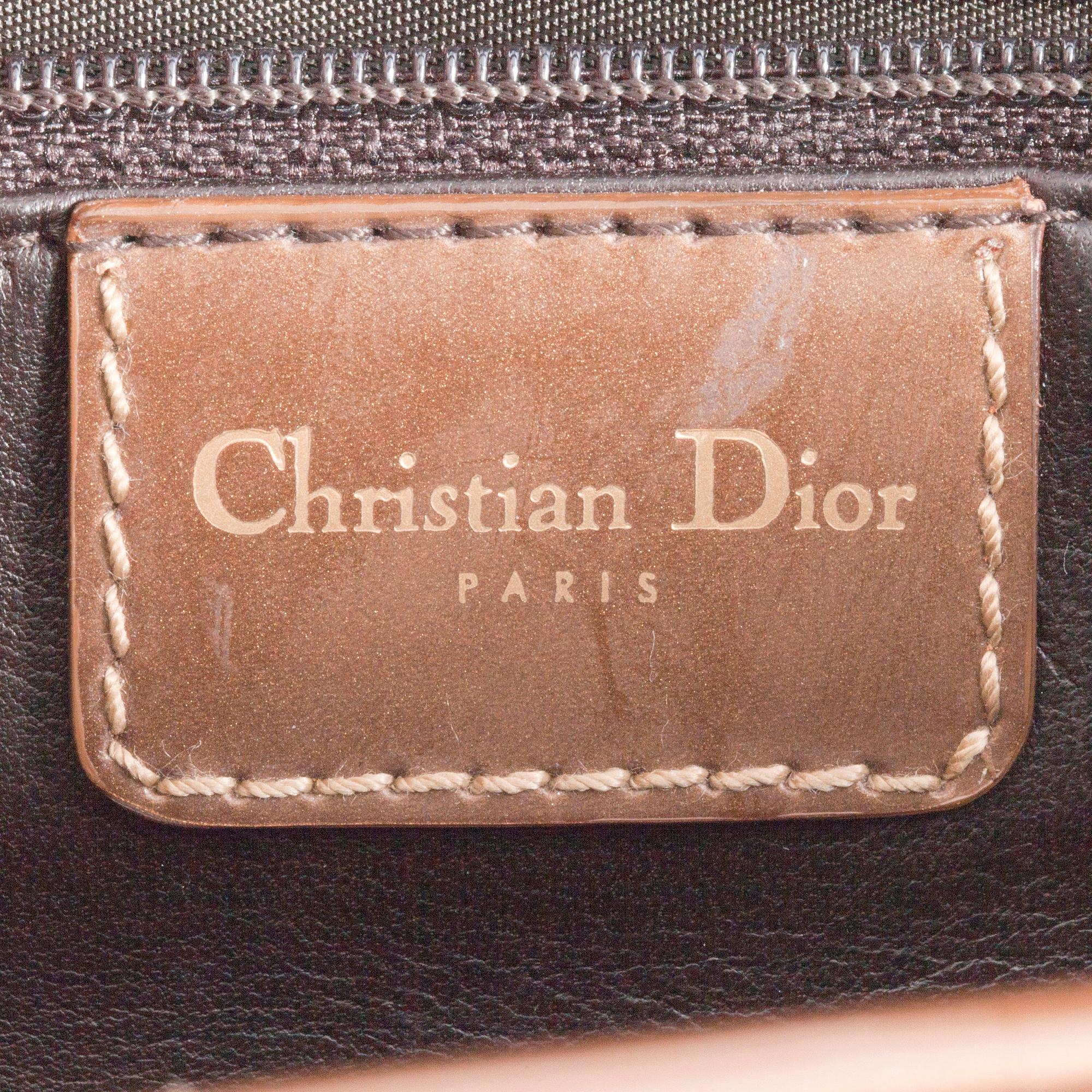 CHRISTIAN DIOR, a gold toned leather handbag, "Saddle bag".