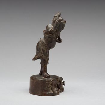 A bronze figure of a deity, Qing dynasty, 17/18th Century.