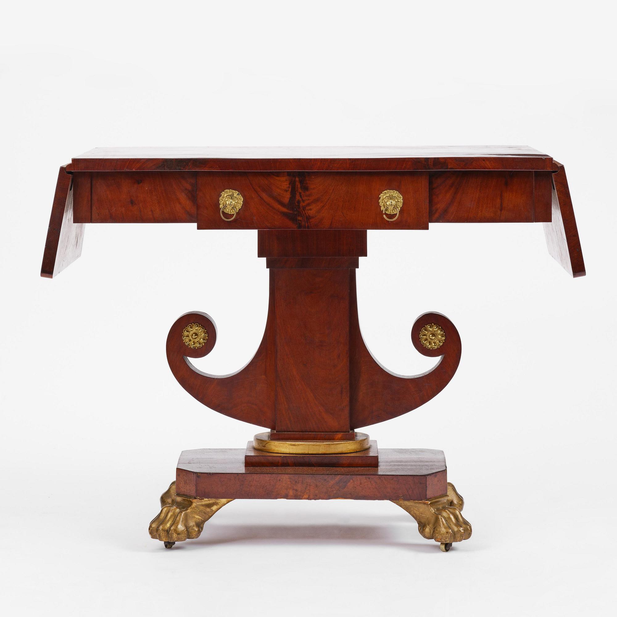 A Swedish Empire mahogany center table.