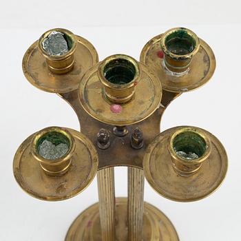 A pair of brass candelabras, first half of the 20th century.