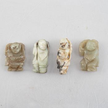 A group of four Chinese stone charms, 20th century.