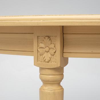 A Gustavian style dining table with six dining chairs, Sweden, 21st century.