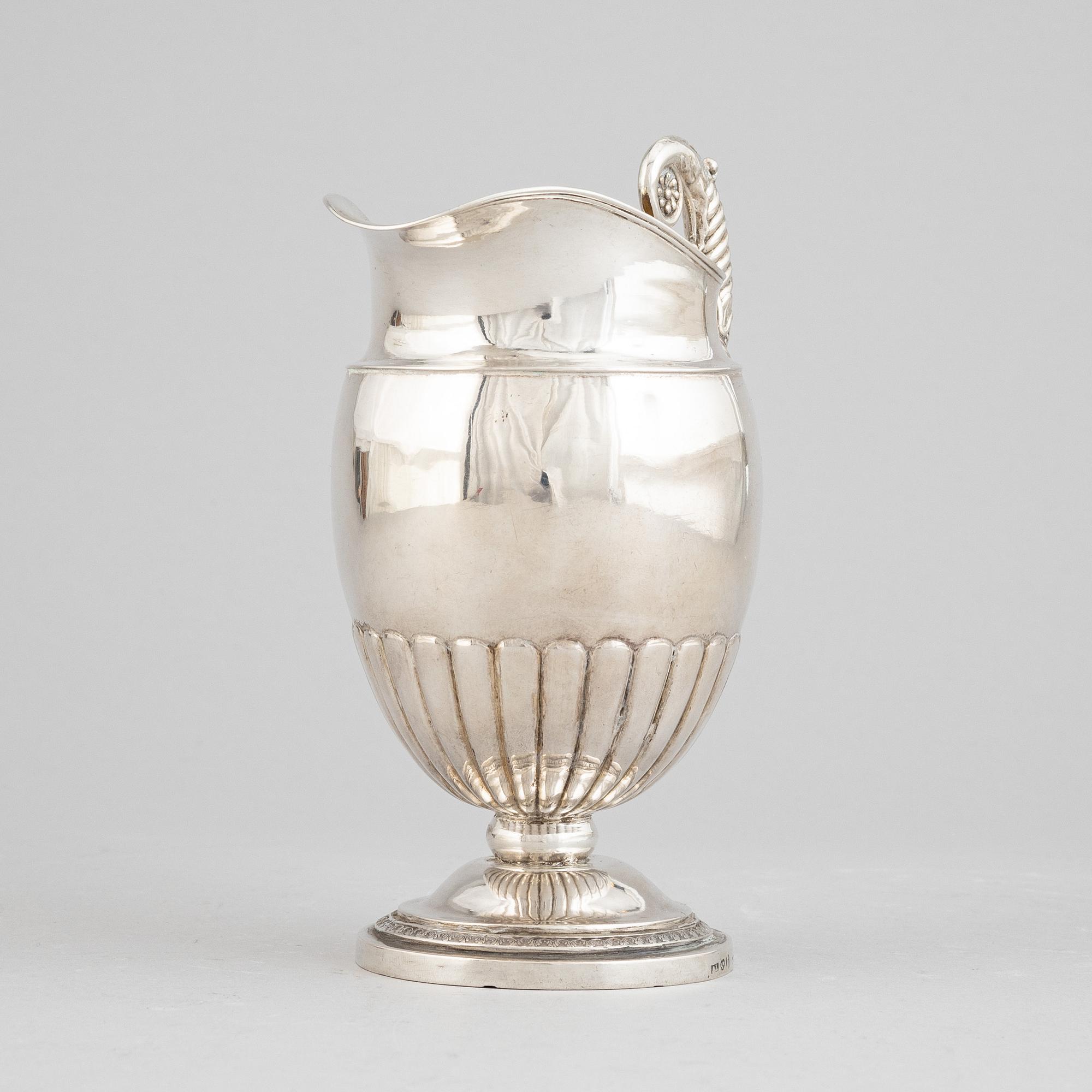 A Swedish empire parcel gilt silver creamer, mark of Anders Lundqvist, Stockholm 1828.