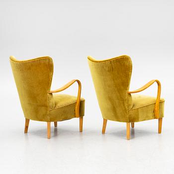 A pair of wingback armchairs, Sweden, first half of the 20th century.