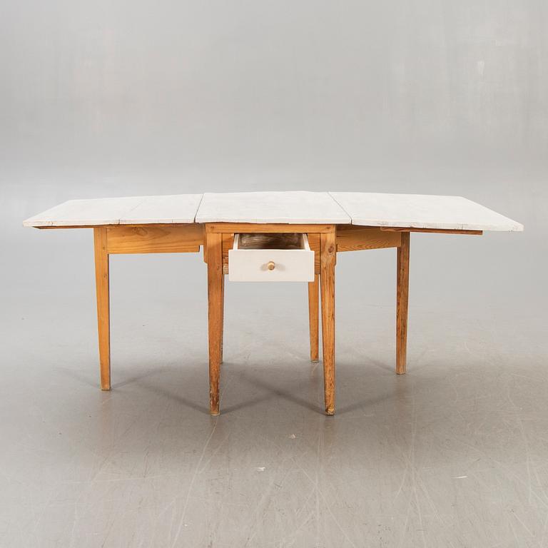 A painted gate legged table later part of the 19th century.