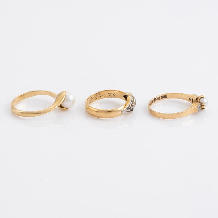 Three pearl and diamond rings.
