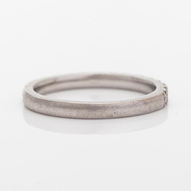 A platinum ring with brilliant cut diamonds.