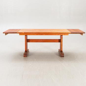 A 1940s pine dining table.