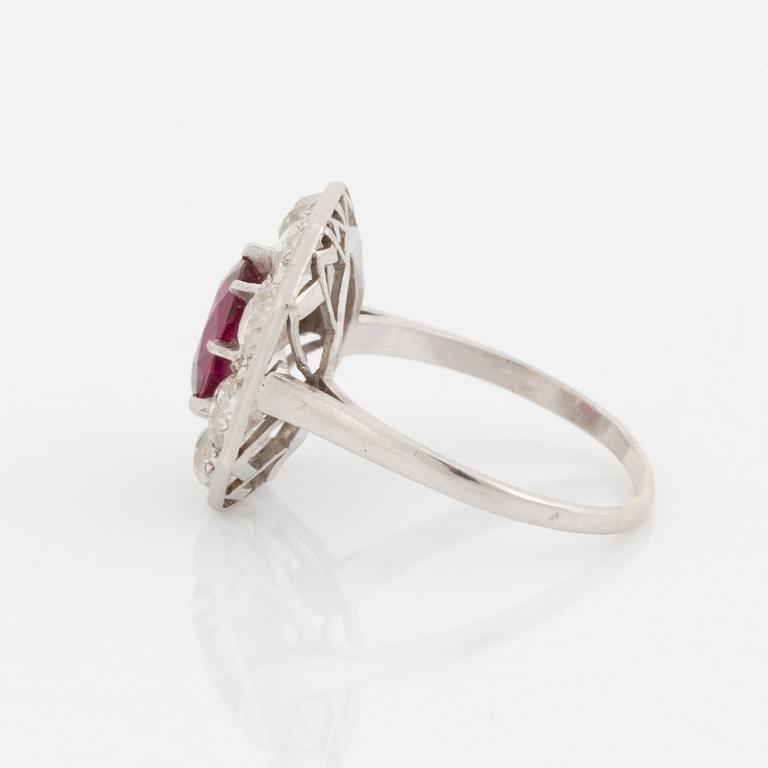 An 18K white gold ring set with a ruby and old-cut diamonds.