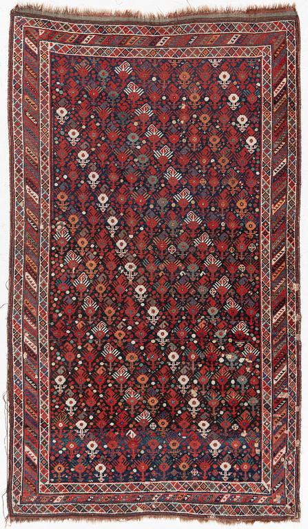An antique Qashgai rug, 230 x 135 cm.