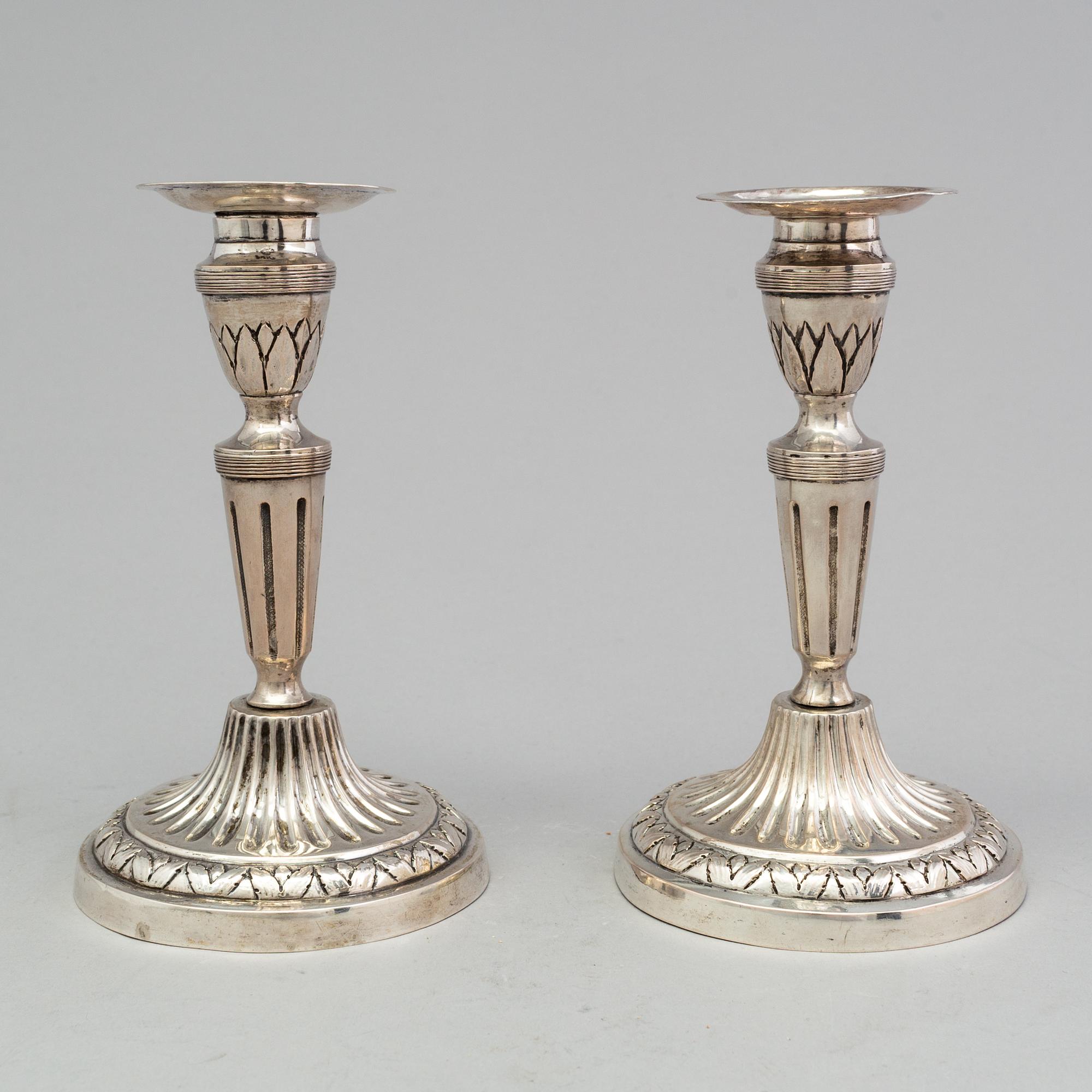 A pair of late 18th century silver candlesticks with unclear hallmarks, possibly from Germany. Weight ca 316 grams.