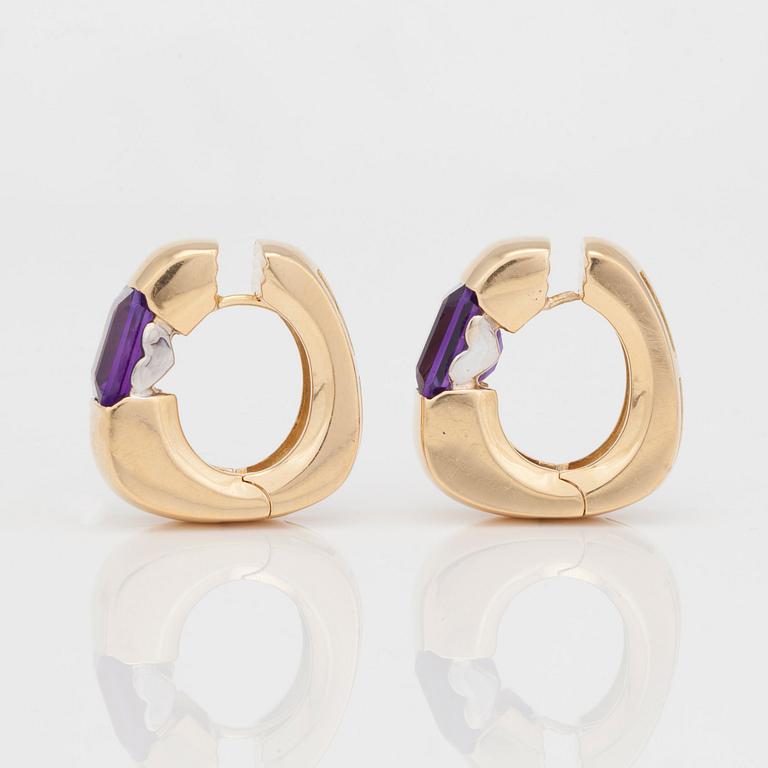 A pair of gold and amethyst earrings.