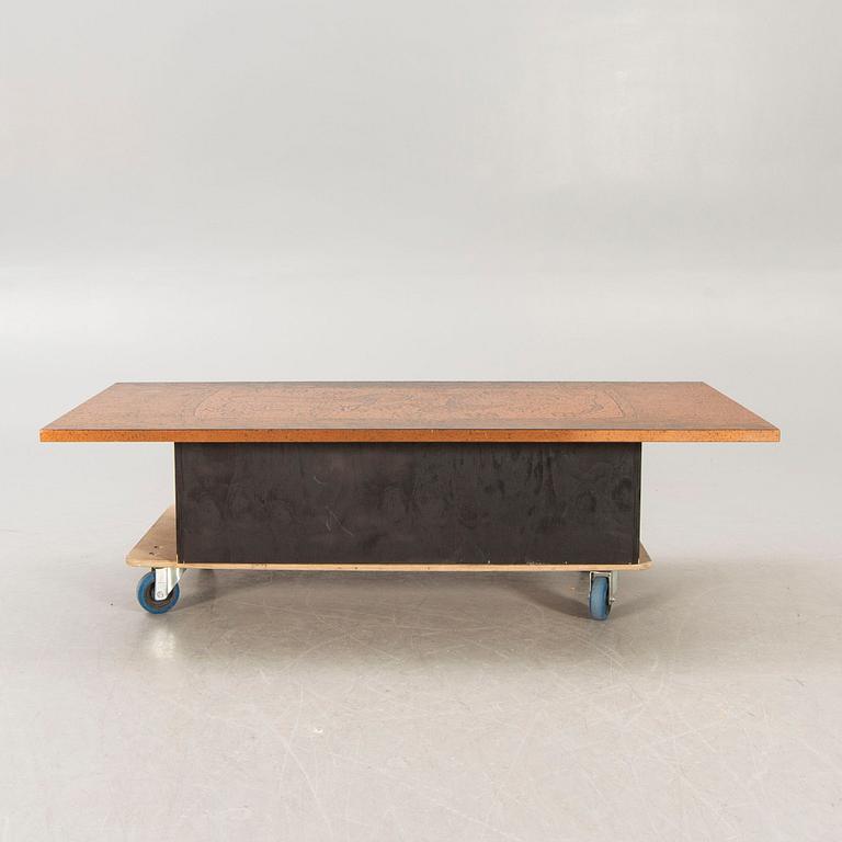 A 1970s copper coffee table.