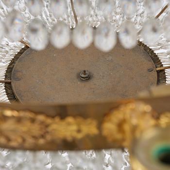 An ormolu and cut glass sixteen-branch Empire chandelier, Paris, early 19th century.