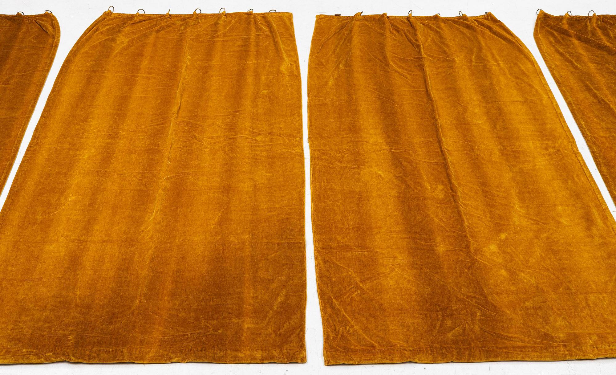 A set of four yellow velvet curtains, 1910's/20's, ca 247 x 120 cm.