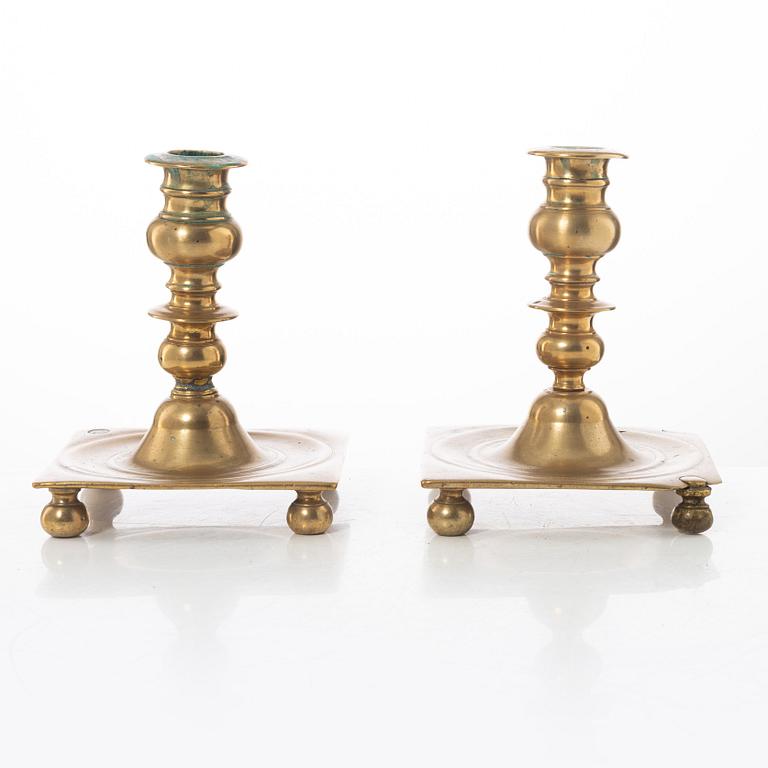 A pair of North European baroque brass candlesticks, circa 1700.