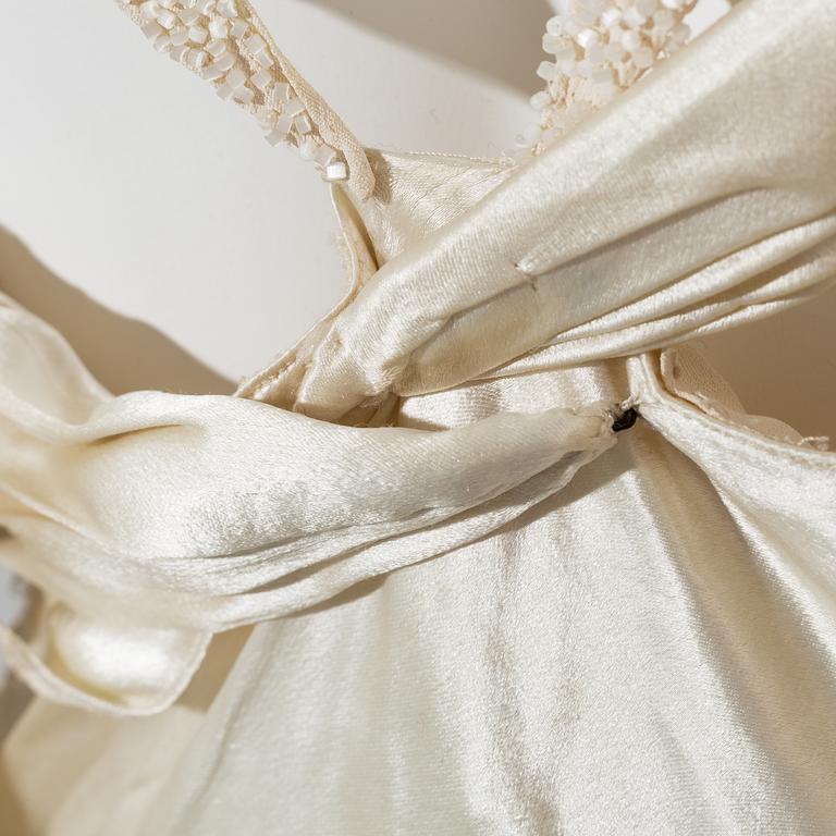 A satin wedding dress, circa 1935.