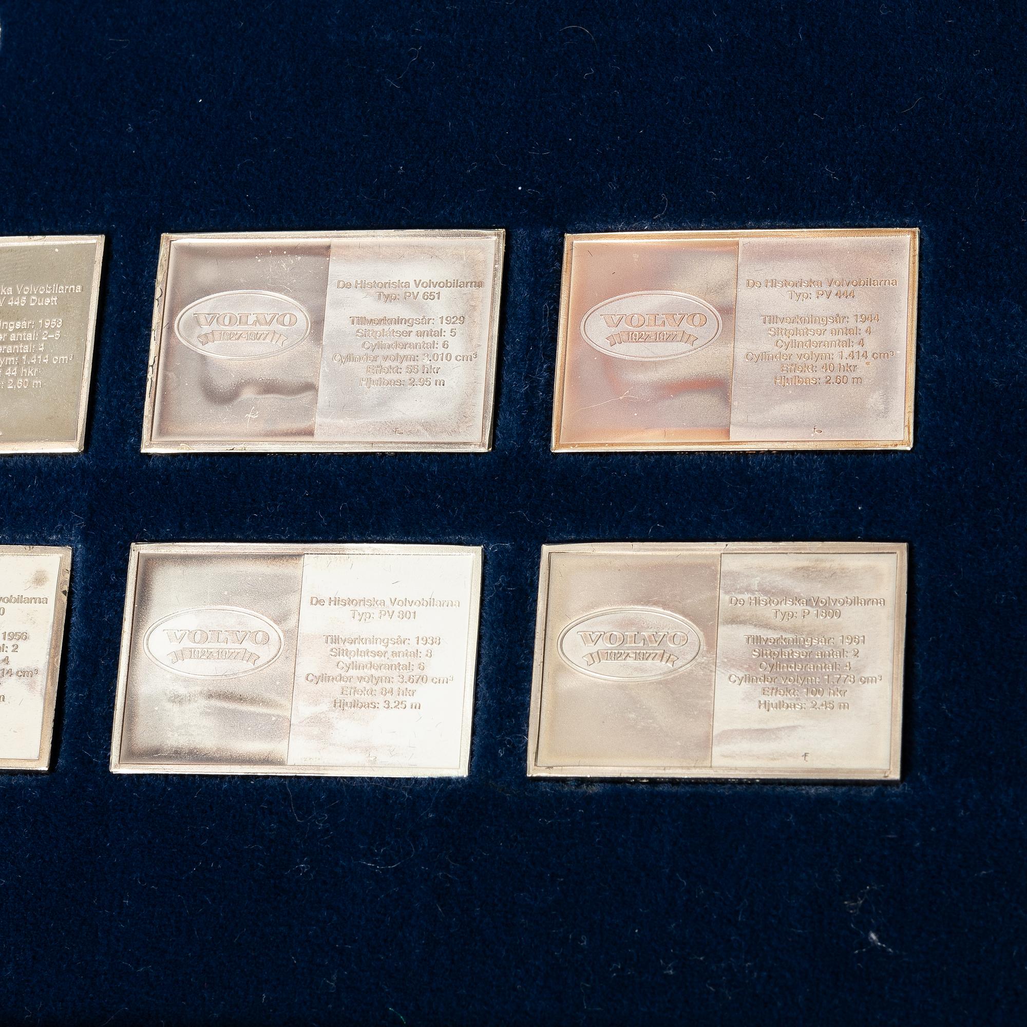 Plaketter, 12 st, silver, "De Historiska Volvobilarna 1927-1977", Franklin Mint.