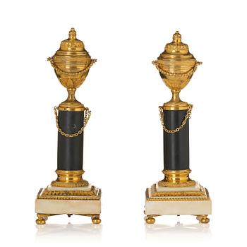 300. A pair of French Louis XVI ormolu and marble cassolettes, late 18th century.