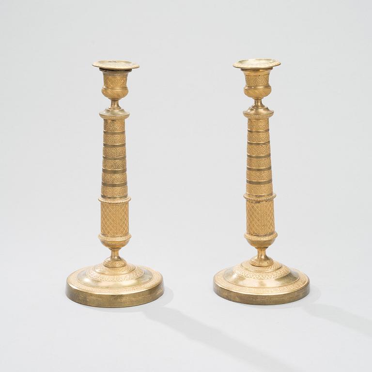 A PAIR OF CANDLESTICKS, gilt bronze, empire early 19th century.