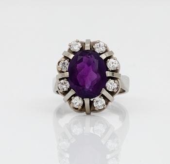 RING, vitguld 18k, ametist, diamanter, 0,72 ct enligt gravyr, Sverige 1964. Vikt ca 11 gram.