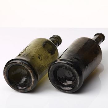 Two green glass bottles, 18th/19th Century.