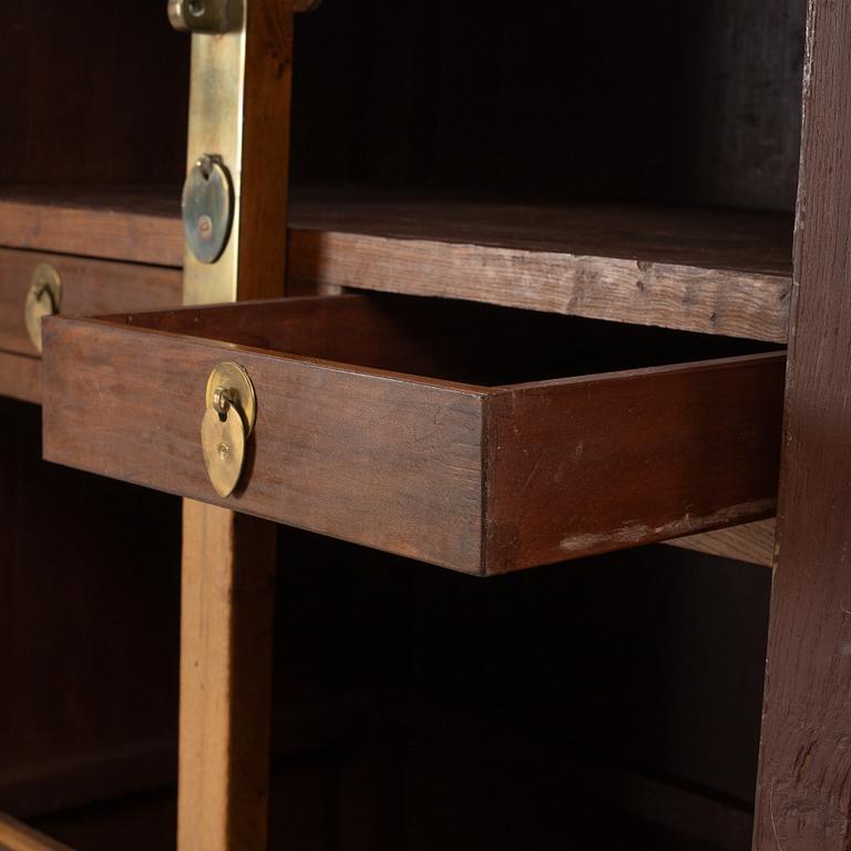 A Chinese hardwood two-part cabinet, 20th century.