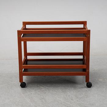 Børge Mogensen, a model '5370' teak and laminate trolley from Frederica Stolefabrik, Denmark.